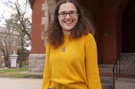 Sarah Nicholls stands outside of Thompson Hall